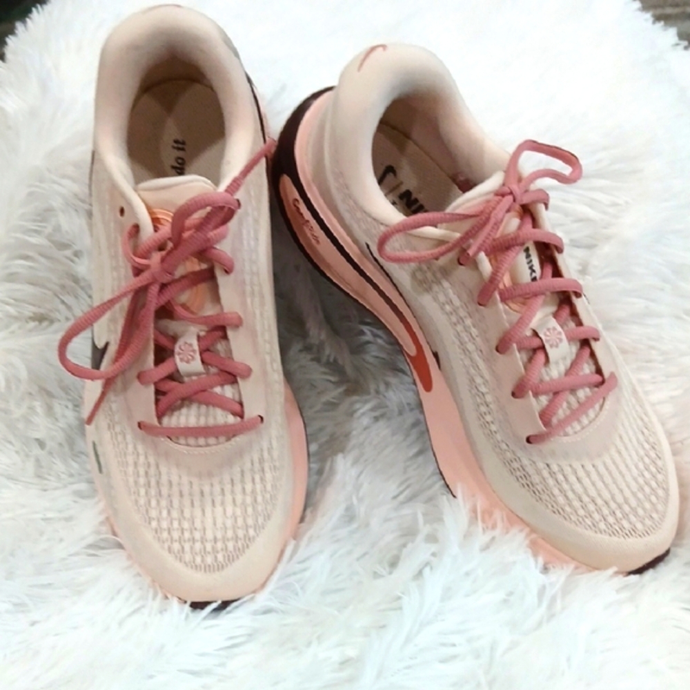 Nike Pink and White Athletic Shoes with Modern Design